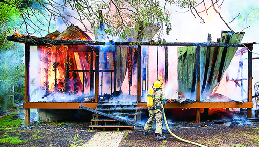 Photo by Brandon Hicks A home on Bishop Hollow Road was destroyed in a fire Thursday afternoon. Firefighters have not been able to determine how the fire started.