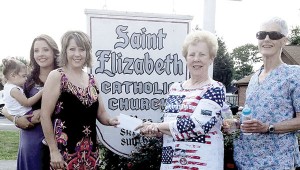 Photo Contributed St. Elizabeth Catholic Church recently held a Baby Bottle Campaign which raised $3,000 for the TLC Community Center to help support the center’s community service programs. From left are Isabella Hope Odom and Bethany Odom, along with their mother Angie Odom, who is the founder and director of the TLC Community Center and St. Elizabeth Catholic Church parishioners Fran Robey and Luster Shell, both of whom helped organize the fundraiser.