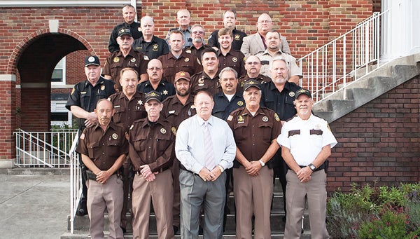 Photo by Brandon Hicks Carter County's constables completed their annual training requirements this past week. A graduation ceremony was held for the group on Thursday evening. The constables are shown here with some of their trainers and several guests from surrounding counties who attended the training as well.