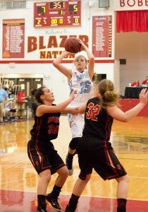 Photo by Bryce Phillips Hampton's Shyanne Tuelle puts up jumper in traffic.