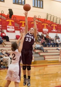 Unaka's Sierra Wright fires off a jumper, while Lady Indians' Tori Williams guards.