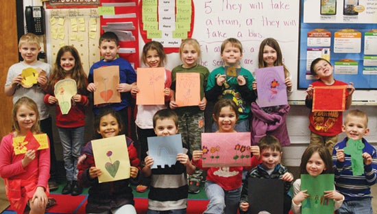 Photo by Abby Morris-Frye Students at Unaka and Keenburg Elementary schools recently made cards to send to sick children at the Ronald McDonald House as a project for the National Day of Service. Here, a group of first graders at Unaka Elementary shows off the cards they made.