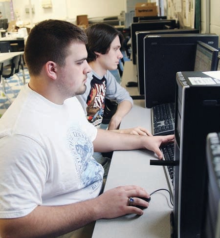 Star Photo/Abby Morris-Frye  John Cole, left, and Justin Simerly work on a CAD architectural design computer program. 