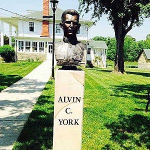 Contributed Photo/Larry Timbs A bust of Sgt. Alvin C. York stands beside a path leading to the family home.