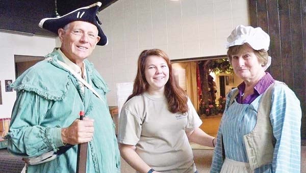 Star Photo/Lynn Richardson Greg, left, and Sherryl Tucker, right, of Pinnacle, N.C., visited Sycamore Shoals State Park on Thursday, where Seasonal Interpretive Ranger gave them a lesson on 18th century clothing.