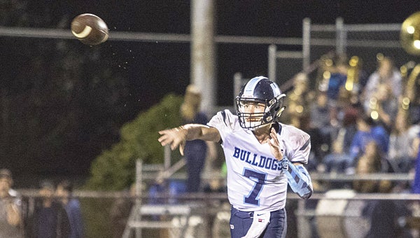 Star Photo/Collin Brooks Hampton's Coby Jones fires off a pass during Friday night's game at Happy Valley High School.
