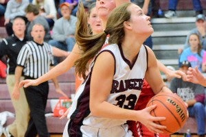 Star Photo/Ivan Sanders  Lady Ranger Sierra Wright looks to put the ball up for two points in Unaka's win over Washburn.
