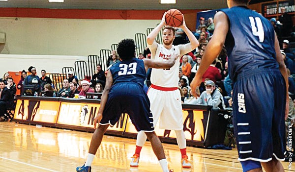 Contributed Photo/Milligan College Milligan's Kurt Brooks scored the game winning shot, during the Buffaloes 68-66 win over Montreat College. Brooks finished the contest with 11 points and 10 rebounds for his second double-double of his career.