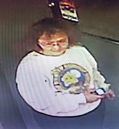 Contributed Photo  Police are asking for the public's help in identifying this woman, who investigators say was caught on camera using someone else's credit card at a city restaurant.