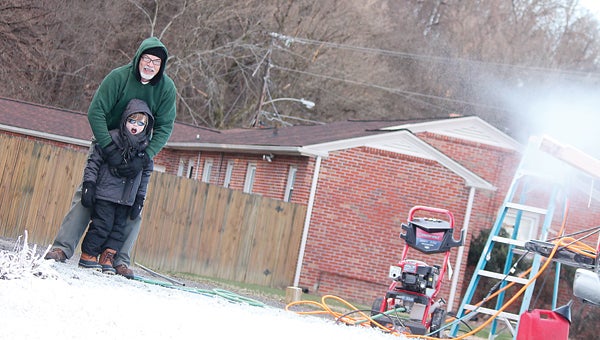 Contributed Photo/Courtney Valentine  Don Iverson and his grandson Jackson enjoy the spoils of their new snow machine.