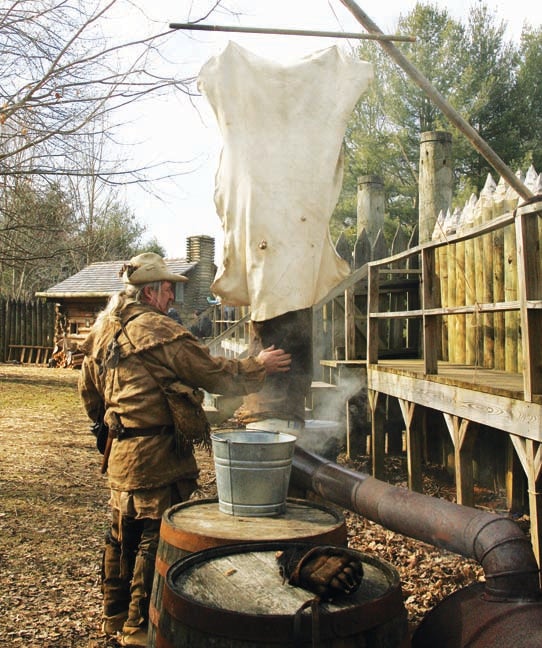 Star Photo/Abby Morris-Frye  During the Winter Militia Muster, visitors to the park will get to see a variety of colonial skills demonstrated. During last year's event, re-enactor Kim Palmer demonstrated a method of smoking hides as a means of tanning them.