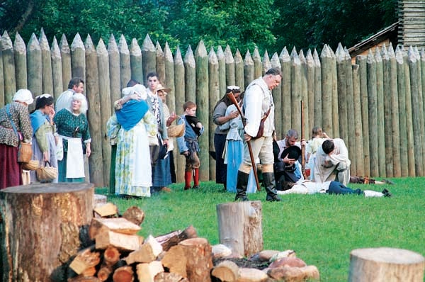 Star File Photo  Settlers mourn the loss of family and friends following a skirmish with a Cherokee raiding party.