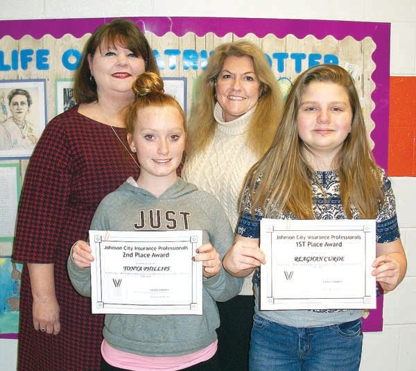 Contributed Photo/Central Elementary Central Elementary students Thonya Phillips, front row left, and Reaghan Curde, front row right, recently received awards from the Johnson City Insurance Professionals for their contributions to an essay contest. The students are seen here with Tennessee Council of Insurance Professionals representative Cynthia Ayers and Central Elementary sixth grade language arts teacher Shari Pearman.