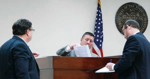 Star Photo/Abby Morris-Frye  Tennessee Bureau of Investigation Special Agent Scott Lott, center, describes photographs he took at the scene of a police shootout in December during a preliminary hearing held on Friday for the man charged with opening fire on officers.
