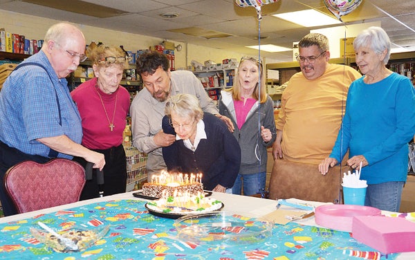 Star Photo/Rebekah Price  Barbara Fraser celebrated her 95th birthday Wednesday with fellow volunteers at Assistance Resource Ministries.