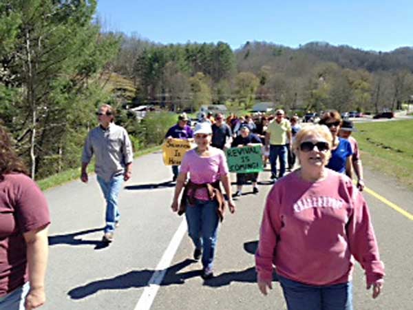Approximately 100 people participated in a prayer walk last year at the Roan Mountain Community Revival. The prayer walk will be held again this year at 3 p.m. April 2 to open a two-week revival in the community. Twelve churches will participate in this year's meeting.