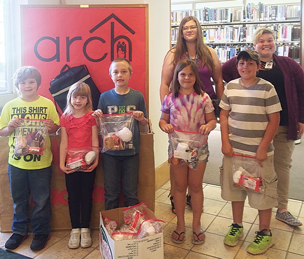 Contributed Photo Children from Roan Street Freewill Baptist Church wanted to help people in their community by donating practical items at the library for homeless residents.