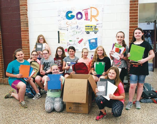 Star Photo/Abby Morris-Frye  Members of the Girls On The Run chapter at Happy Valley Elementary School are collecting school supplies to help students in their school whose families cannot afford to purchase the supplies.