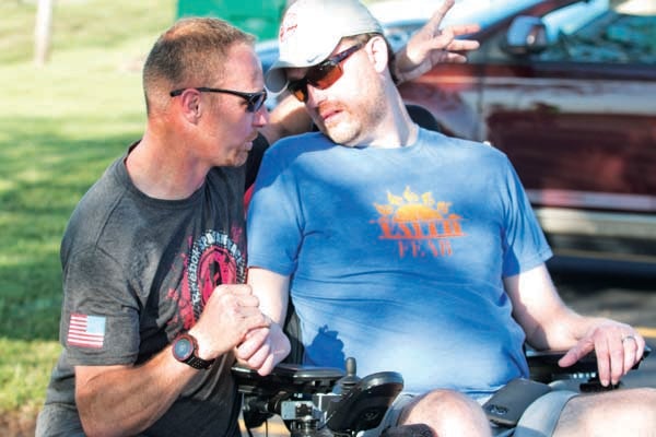 Star Photo/Bryce Phillips  Jeff Vance, winner of Thursday's Wheels for Wandell 5k, speaks with Dr. Josh Wandell after crossing the finish line. Even though he came in first, Vance said that the 5K was not about winning, but instead about helping someone who has made an impact on him.