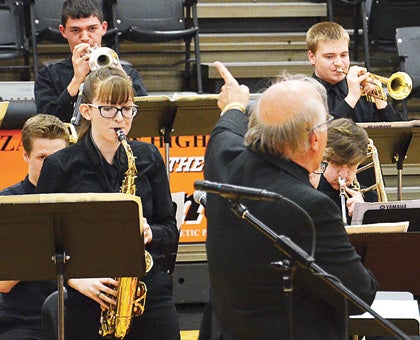 Star Photo/Rebekah Price Hayley Jarnagin performed her first solo on the saxophone at Thursday's Jazz Band concert, garnering audience applause and excited approval by Band Director Perry Elliott.
