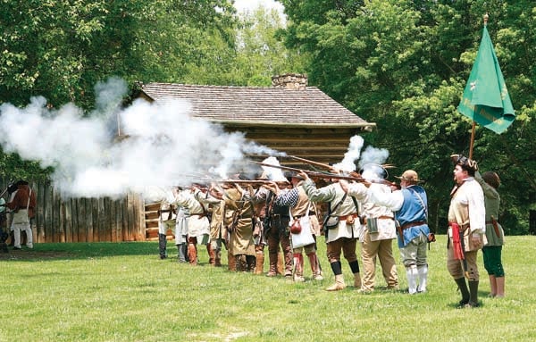 Star File Photo Militia members open fire on advancing British and Cherokee forces during the siege.