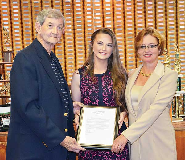 Star Photo/Rebekah Price Nursing Scholarship Chairman Ken Swift and Elks Lodge President Jacklyn Morris presented Hannah Smith with an $8,000 scholarship at Dino's Restaurant Thursday.