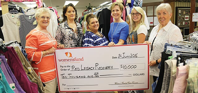 Star Photo/Curtis Carden  The Women's Fund of East Tennessee presented Red Legacy Recovery a grant for $10,000 to assist with transportation. The presentation took place at the Red Legacy Thrift Store in downtown Elizabethton. Pictured, left to right, is Cynthia Burnley, Carolyn Shrader, Debra Bradford, Linda Spence, Kayla Eggleston and Judy Ingala.
