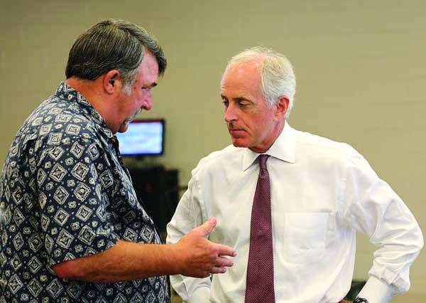 Star Photo/Abby Morris-Frye Local resident Michael Warren speaks with U.S. Sen. Bob Corker during a luncheon on Wednesday.