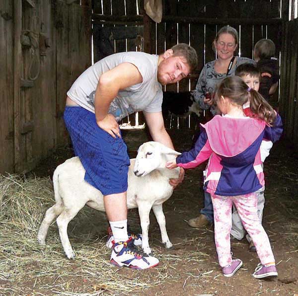 Star Photo/Abby Morris-Frye During their visit to the Drop Farm students learned about the different animals at the farm and got to meet them.
